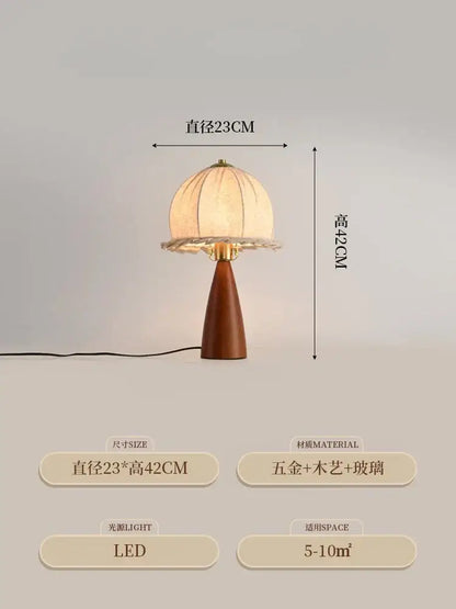 A warm-toned dome-shaped table lamp with gold lustre wood base and gold-tone accents from decorbites gold lustre
