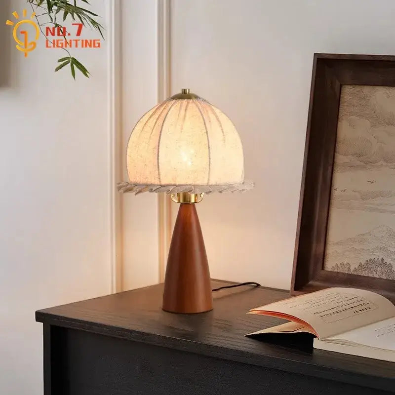 Modern retro gold lustre wood table lamp with warm wood base, pleated paper shade, and brass accents by decorbites gold lustre