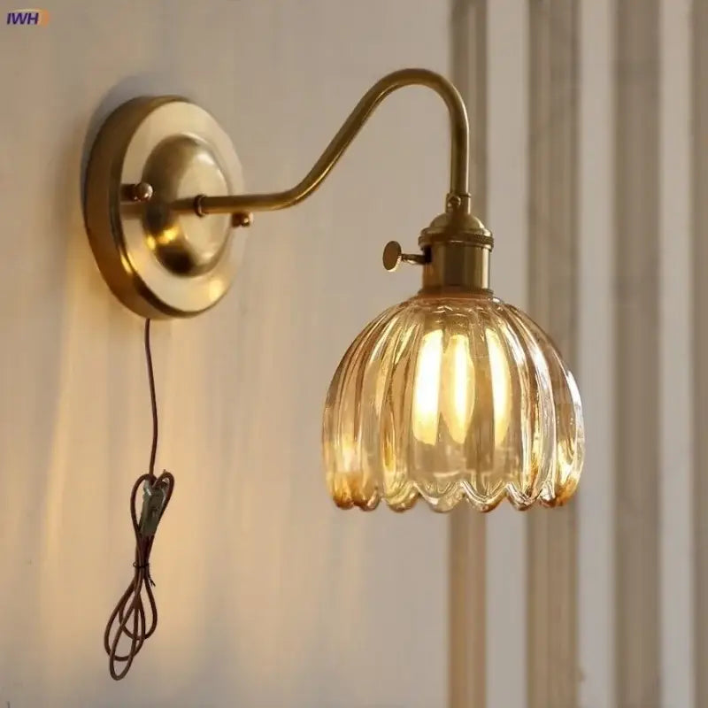 Modern ribbed amber glass copper led wall sconce featuring a brass fixture for bedroom lighting as a glass copper led wall lamp