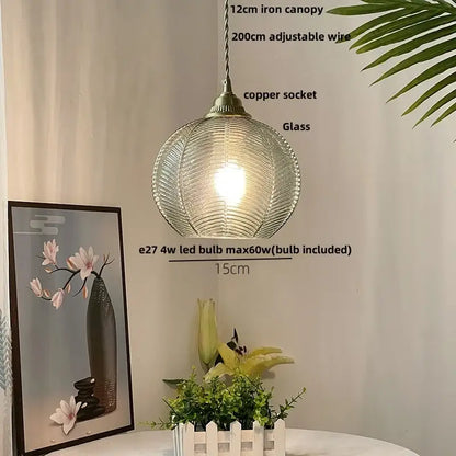 Modern ribbed blue glass led pendant lamp with textured surface and antique brass socket for dining room lighting decorbites blue glass
