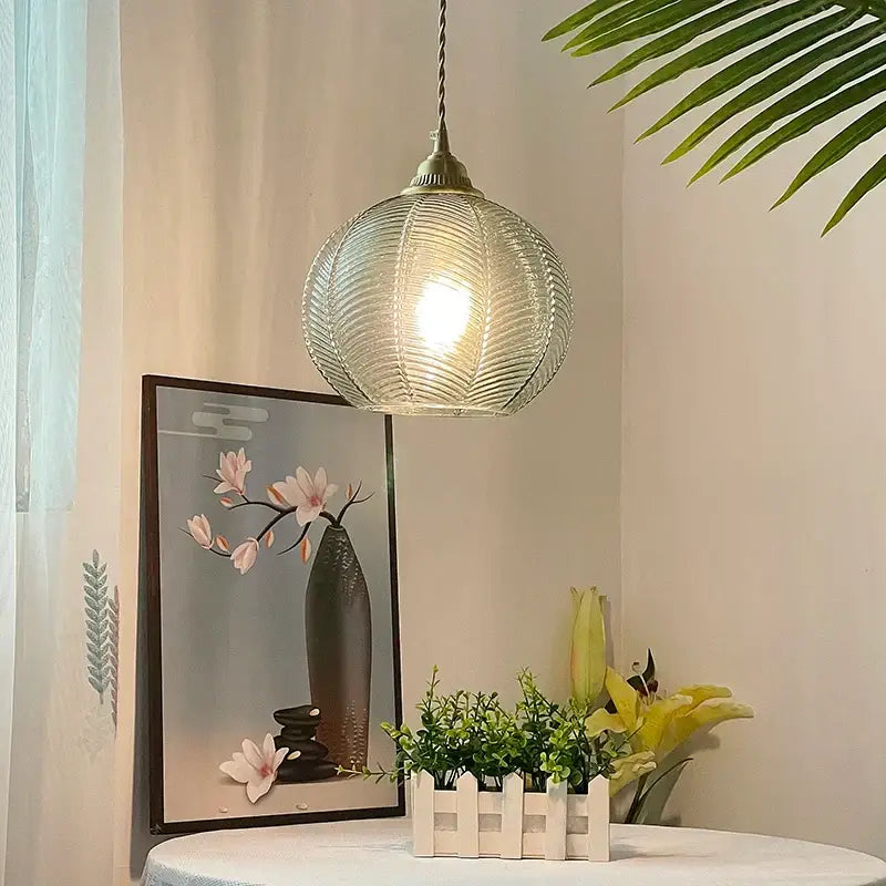 Modern ribbed blue glass led pendant lamp with brass-toned fixture and twisted cord for dining room lighting decorbites blue glass