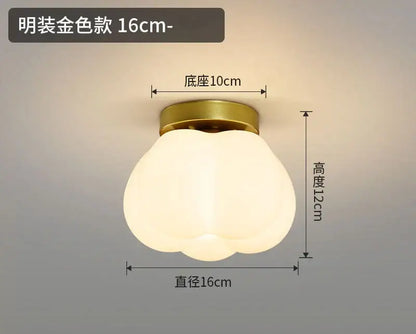 A modern decorbites ceramic glass chandelier with a frosted white ribbed glass and brass base for living room decor