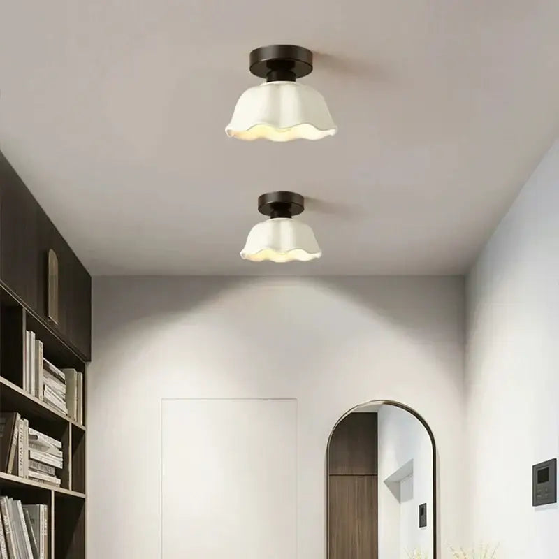 Two matching decorbites ceramic glass chandelier lights with dark bronze fixtures and white ruffled shades for living room decor