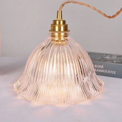 Modern ribbed clear glass pendant light with brass fixture and twisted copper wiring ideal for kitchen decorbites clear glass