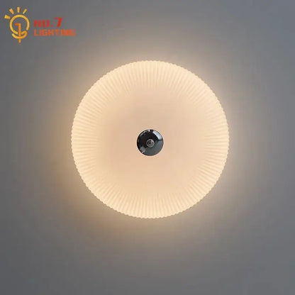Modern ribbed cream glass round ceiling lights featuring a black central fixture for bedroom led lighting decorbites cream glass