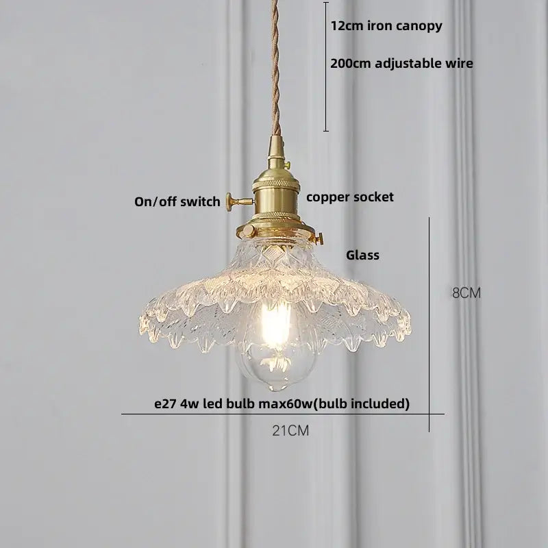 Modern ribbed glass brass led pendant light with a brass-finished copper socket and scalloped clear glass shade for dining room decor