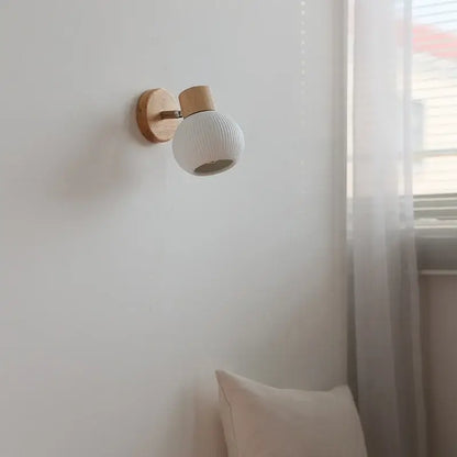 Modern ribbed ceramic led wall lights with white globe and natural wood finish base for bedroom decorbites ceramic led use
