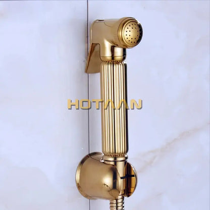 Modern ribbed gold brass bidet sprayer set featuring a gold-colored handheld bidet sprayer with a sleek metallic finish