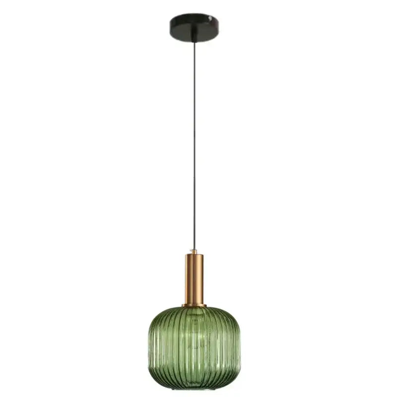 Modern ribbed green pumpkin glass pendant light with brass metal stem and black ceiling mount for dining room decorbites