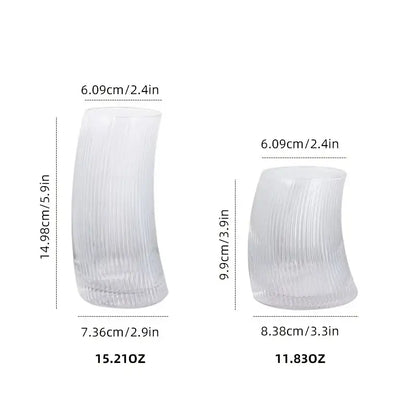 Clear glass cups with vertical ribbed texture and elegant curved sail-shaped design perfect as decorbites sail-shaped glass tumblers