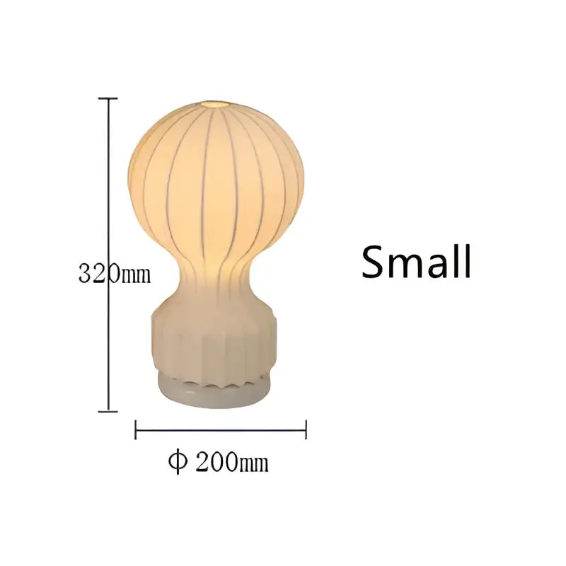 Beige hot air balloon-shaped ribbed ceramic table lamp with textured base modern decorbites gatto silk table lighting