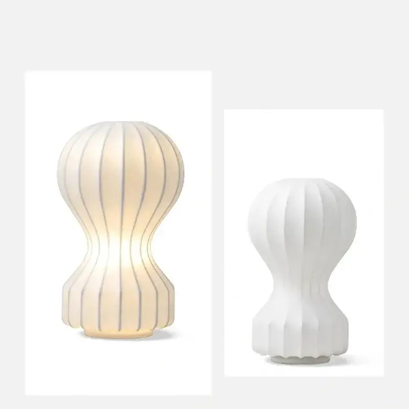 Modern ribbed white ceramic table lamp with soft warm glow ideal for bedroom decorbites gatto silk table use