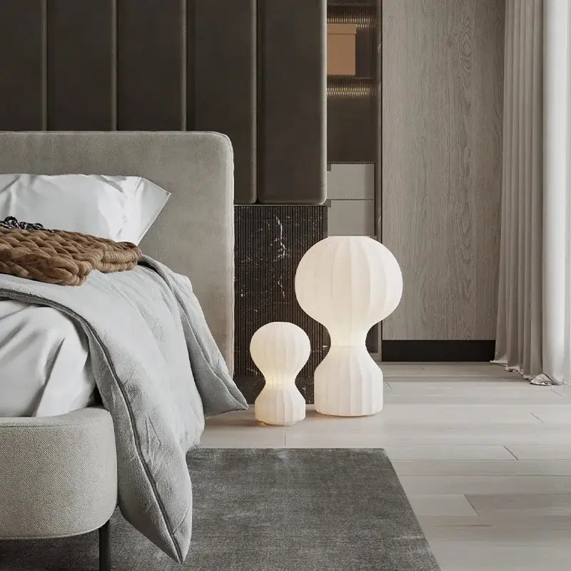 Two white ribbed ceramic table lamps with a modern organic design for bedroom decorbites gatto silk table use