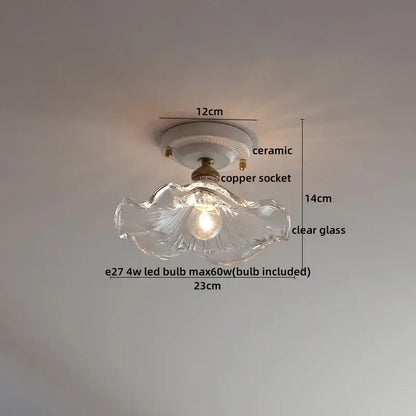 A clear glass ceiling light with scalloped edge, cream ceramic led ceiling base, and copper socket for living room decorbites ceramic led