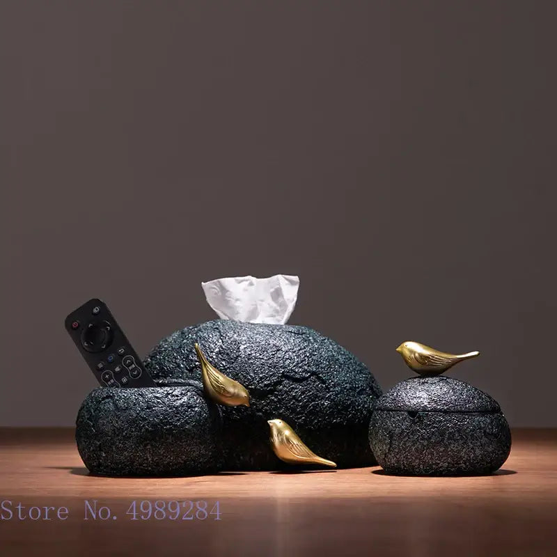Modern rock textured black stone tissue box with gold bird resin accents for living room decor by decorbites golden bird