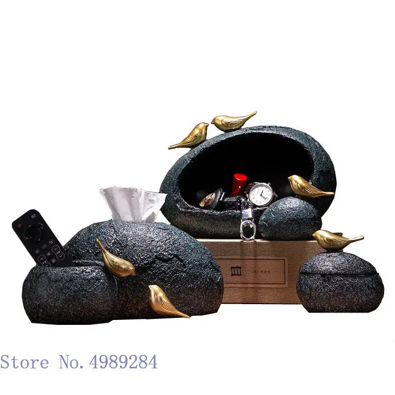Modern rock textured black tissue box set with golden bird resin accents for elegant living room decor by decorbites