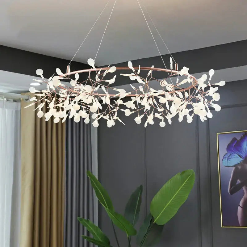A modern rose gold pendant light with copper tones and white glass leaf shapes as light sources for dining rooms
