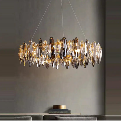 A modern rose gold pendant light with circular faceted crystal dimmable led droplets for dining room decorbites