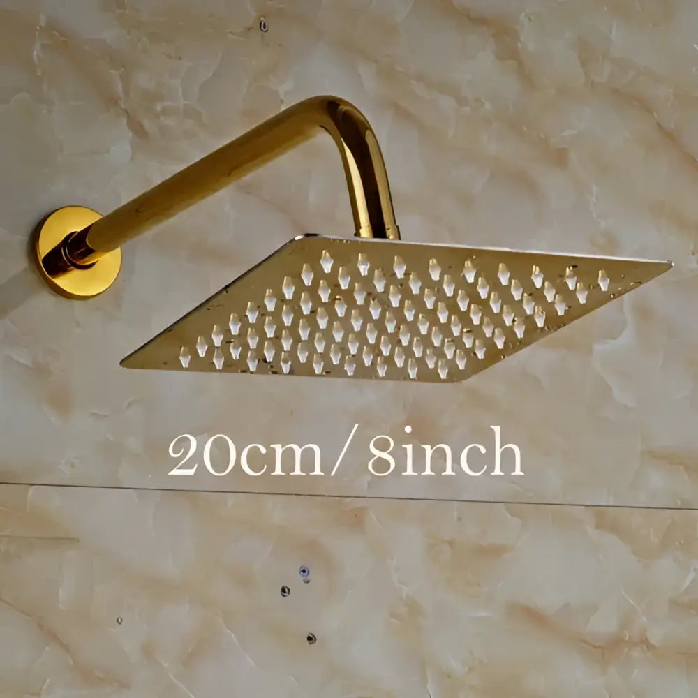 Modern square gold ultrathin shower head set with perforated surface and curved arm for rainfall shower experience