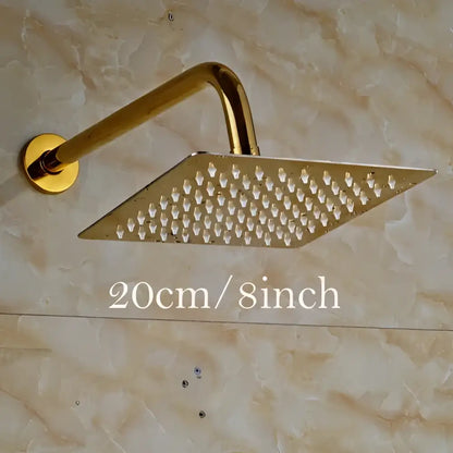 Modern square gold ultrathin shower head set with perforated surface and curved arm for rainfall shower experience