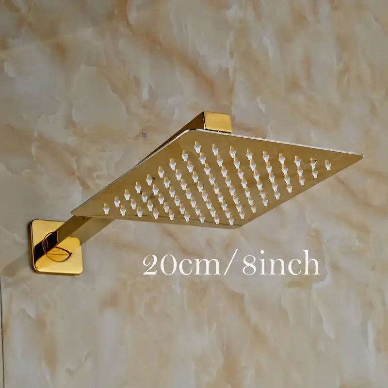 Modern round gold ultrathin square shower head set with sleek metallic finish and evenly spaced spray nozzles