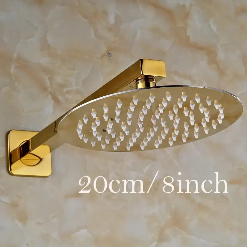 Modern round gold ultrathin 8-inch rainfall shower head set with sleek metallic finish and multiple water nozzles arranged in grid pattern