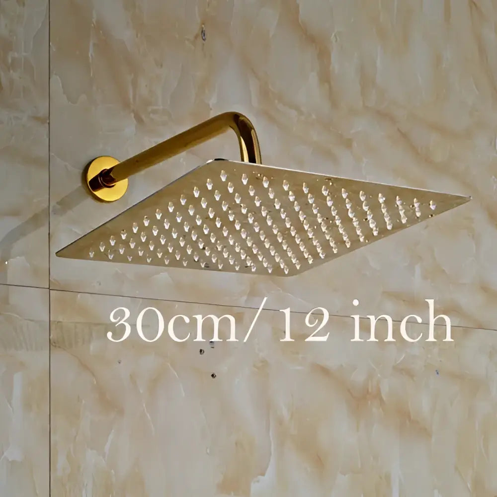 Modern round gold ultrathin square shower head set with small nozzles and curved mounting arm for bathroom use