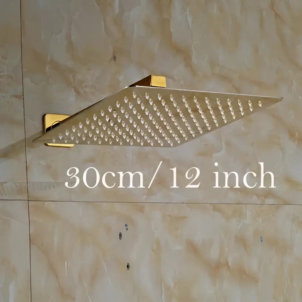 Modern round gold ultrathin rainfall shower head set with a gold-colored square shower head and sleek metallic finish