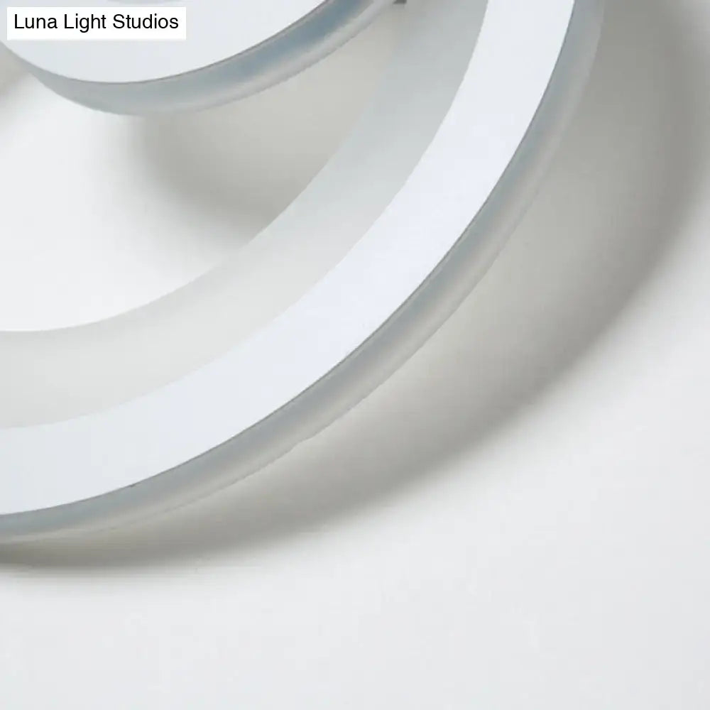 A sleek white circular modern round wall light with warm white LED and smooth glossy finish 8 inch fixture