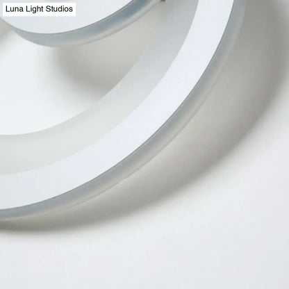 A sleek white circular modern round wall light with warm white LED and smooth glossy finish 8 inch fixture
