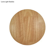 Modern round wood led wall lighting light fixture with light brown circular wooden disc and natural grain patterns for living room