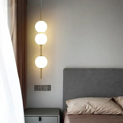 Modern sage green decorbites glass ball led pendant lamps with frosted glass spheres and gold-toned rods for living room decor