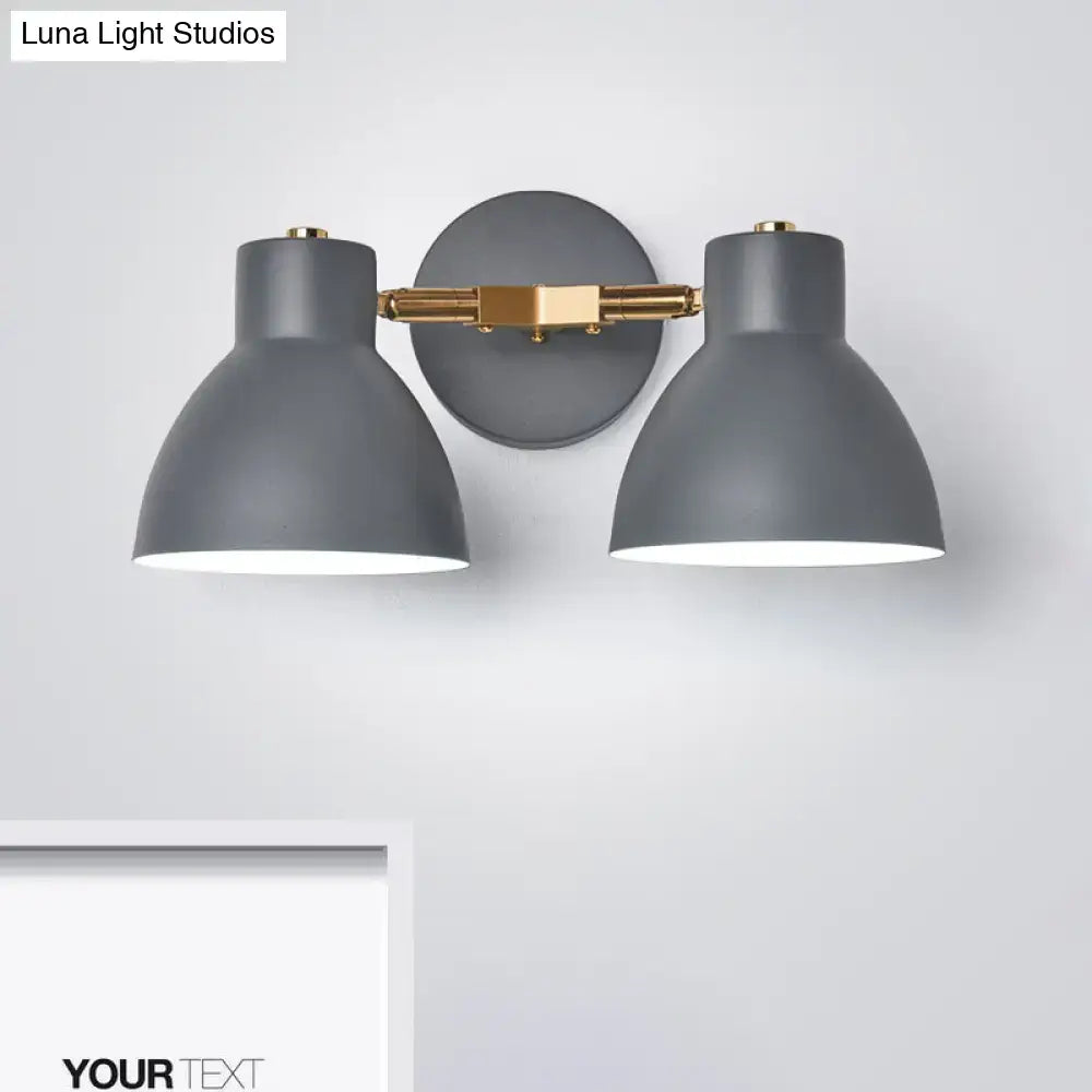 Modern sage green and gray double shade wall sconce with direct wired gray matte black shades and brass-finished arms
