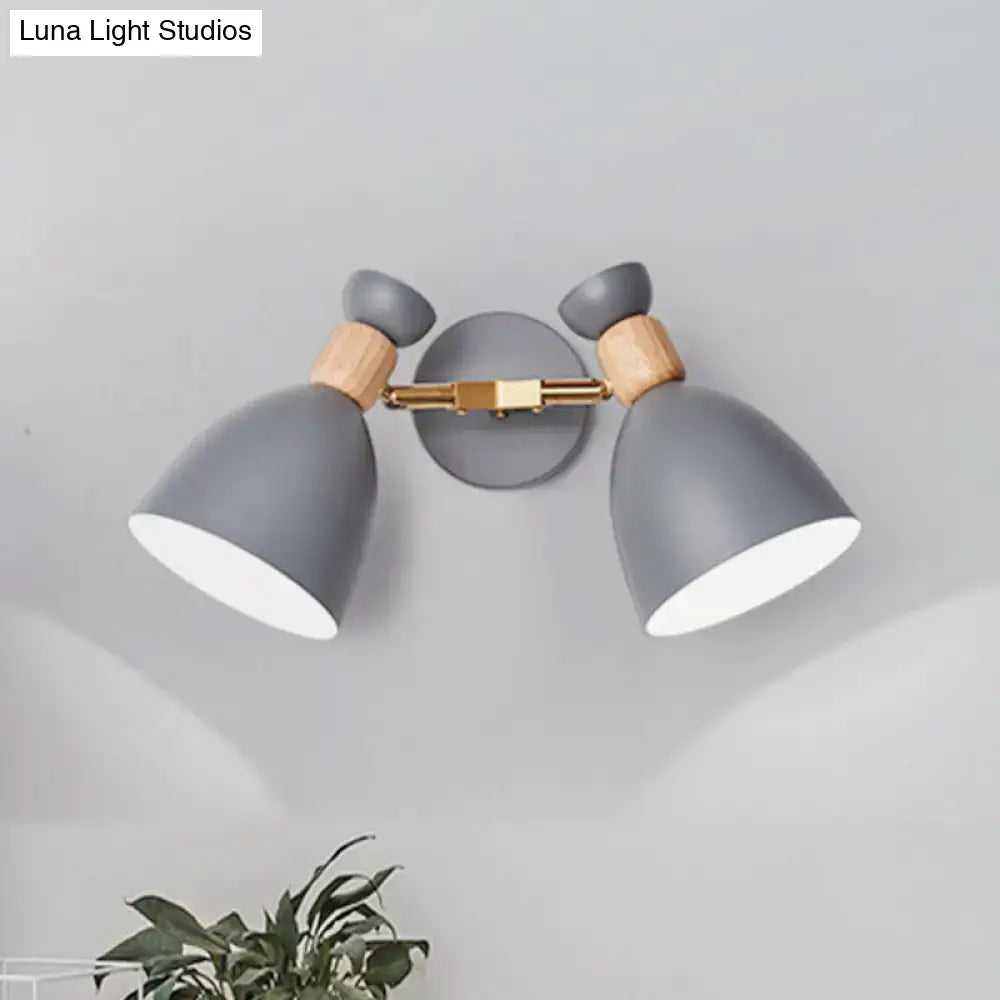 Modern sage green and gray double shade wall sconce with wooden accents and brass hardware measures inches high