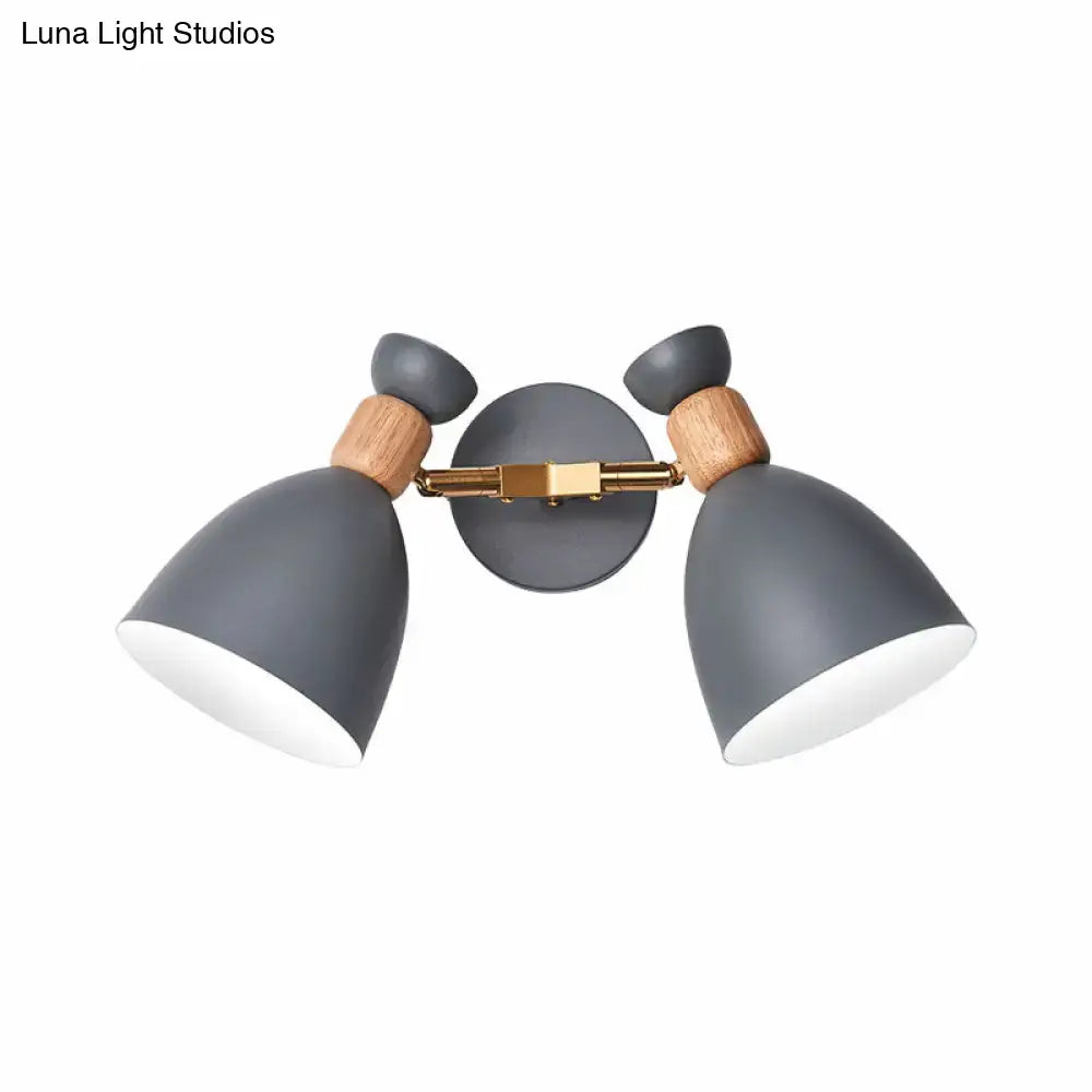 Modern gray wall sconce with double shade featuring wooden accents and brass hardware, inches high for living room lighting