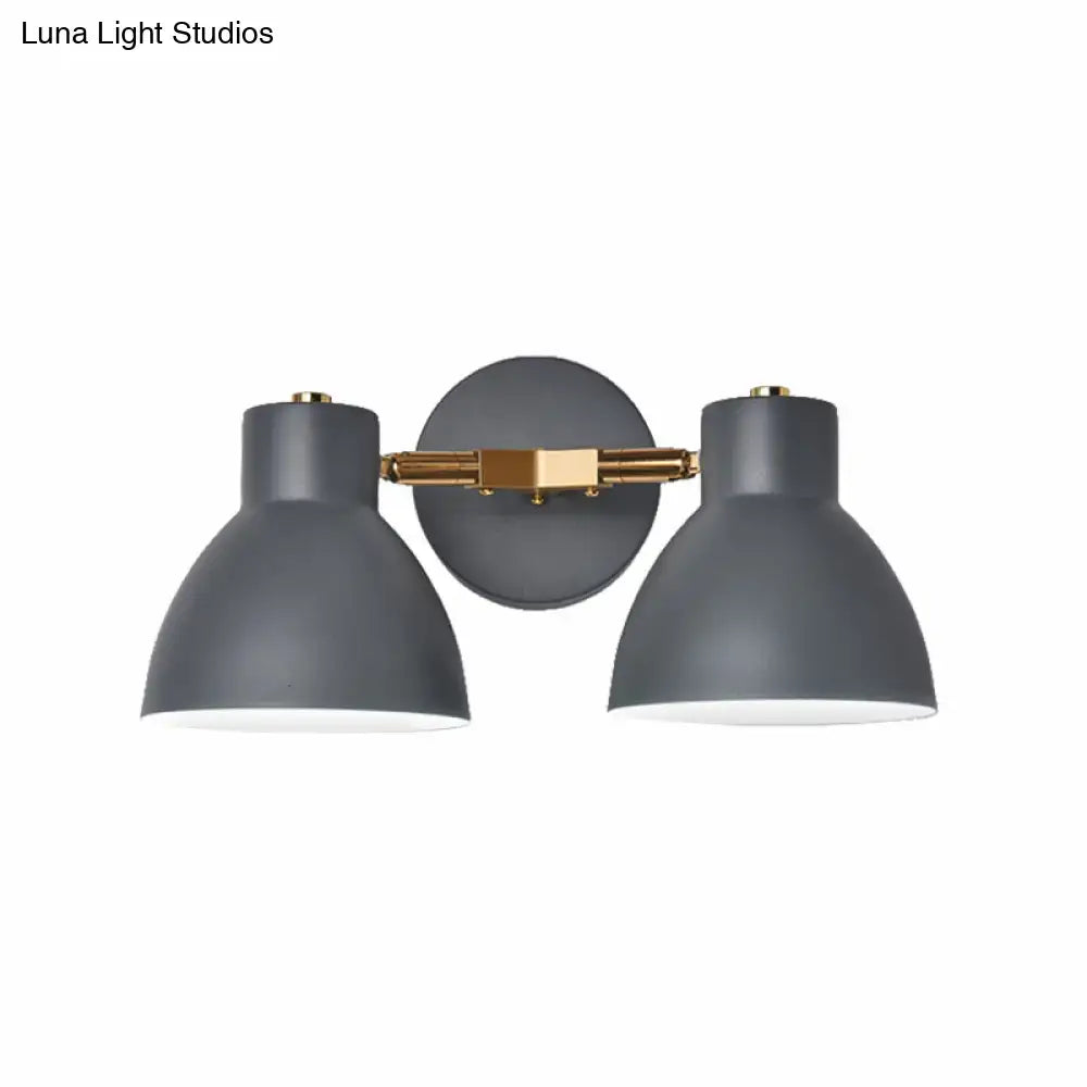 Modern sage green and gray double shade wall sconce with matte gray shades and brass accents measures inches high