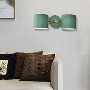 Modern sage green double shade wall sconce with brushed brass fixture direct wired for living room lighting