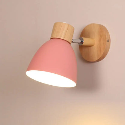 Modern sage green macaron wood wall light fixture featuring a pink matte wall light with natural wood base and adjustable arm for corridor use