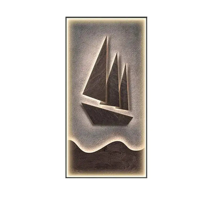 A sleek modern sailboat led wall lamp carved from dark stone with three triangular sails for living room decor