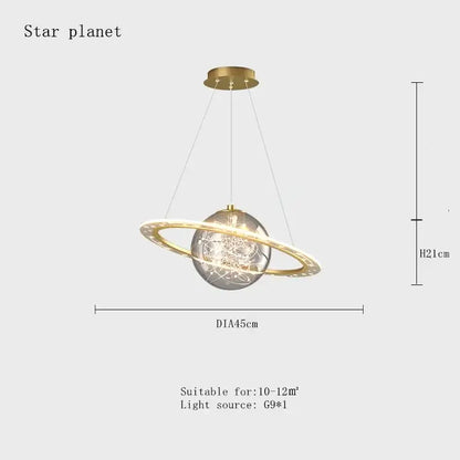 Gold-toned pendant lamp with clear glass sphere and glowing ring resembling a space star astronaut for boys bedroom