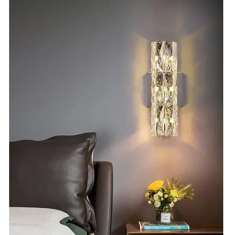 Modern segmented crystal wall lamp with chrome base and warm led light for elegant living room decorbites crystal wall lamp