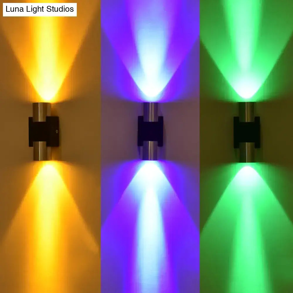 Modern silver aluminum dual-head wall light fixture with sleek metallic finish and vibrant colored accent lighting