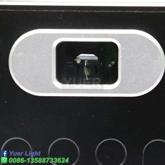 Silver oval camera lens housing set in black surface of modern silver and black decorbites 10w rgb laser light projector
