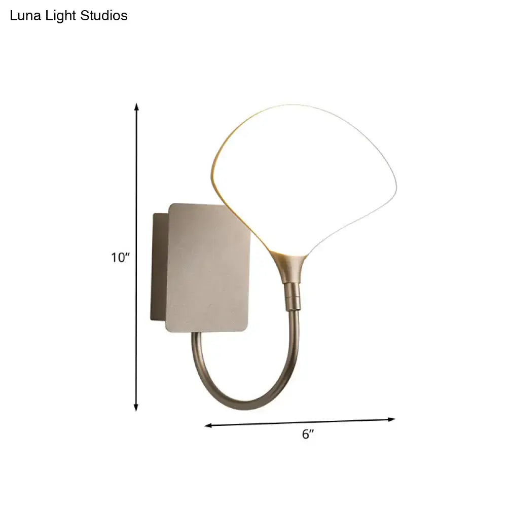 Modern silver arced arm wall lamp with brass finish and acrylic shade featuring a sleek curved arm for bedroom lighting