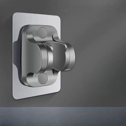 Silver metallic wall-mounted shower holder bracket with sleek modern design and rounded edges for bathroom use