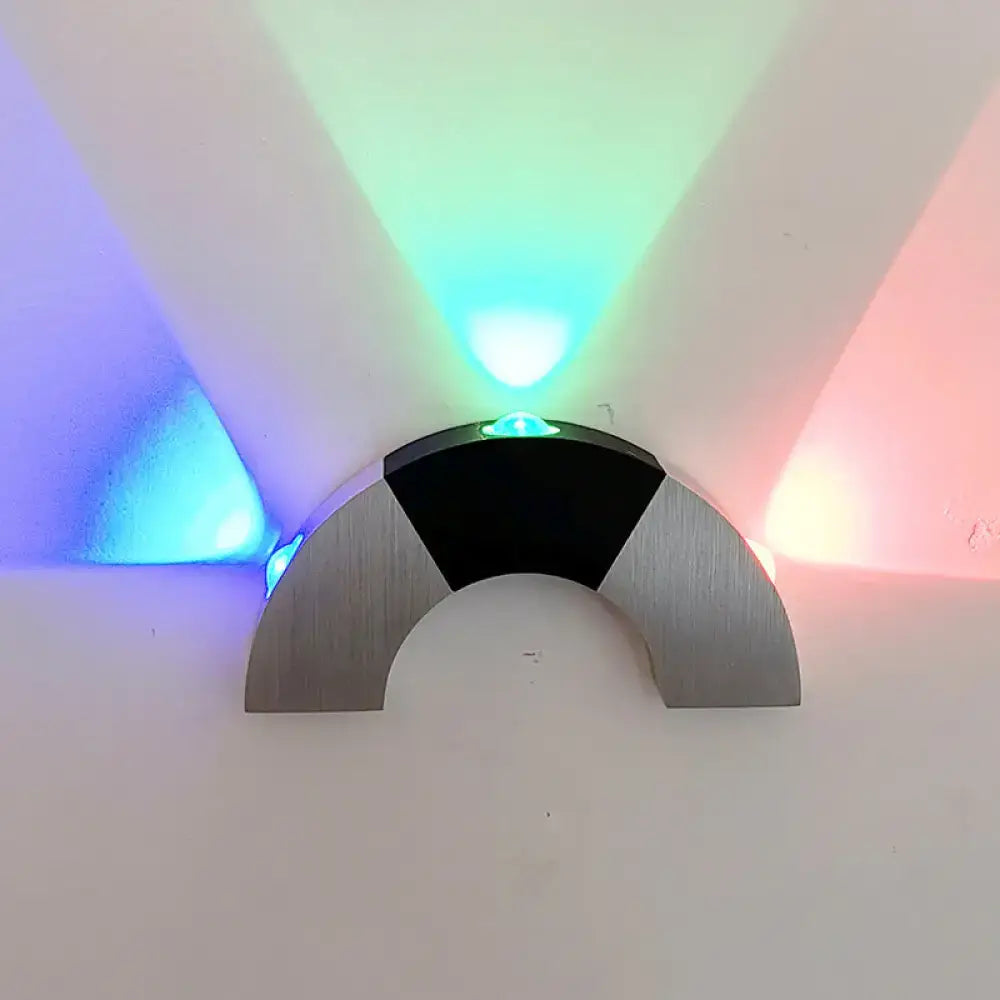Modern silver and black arched wall light with brushed metal finish and rgb color led emitting colorful beams for living room