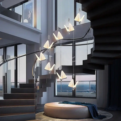 A modern silver decorbites butterfly led chandelier pendant light with illuminated fan-shaped fixtures for dining room decor