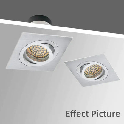 Two sleek modern silver and chrome square ceiling downlight frames with brushed metallic finish and circular led arrays