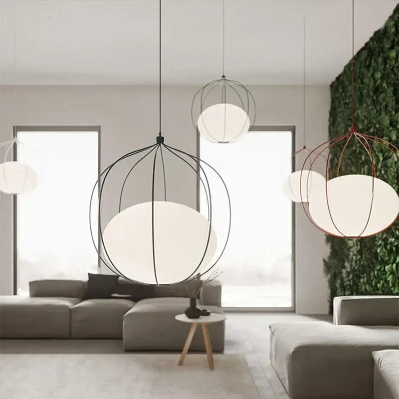 Modern silver and copper decorbites birdcage pendant light with black wire frames and white diffusers for dining room decor