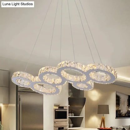 DecorBites™ modern bubble led pendant with stainless steel frame and clear crystal rings designed for island lighting